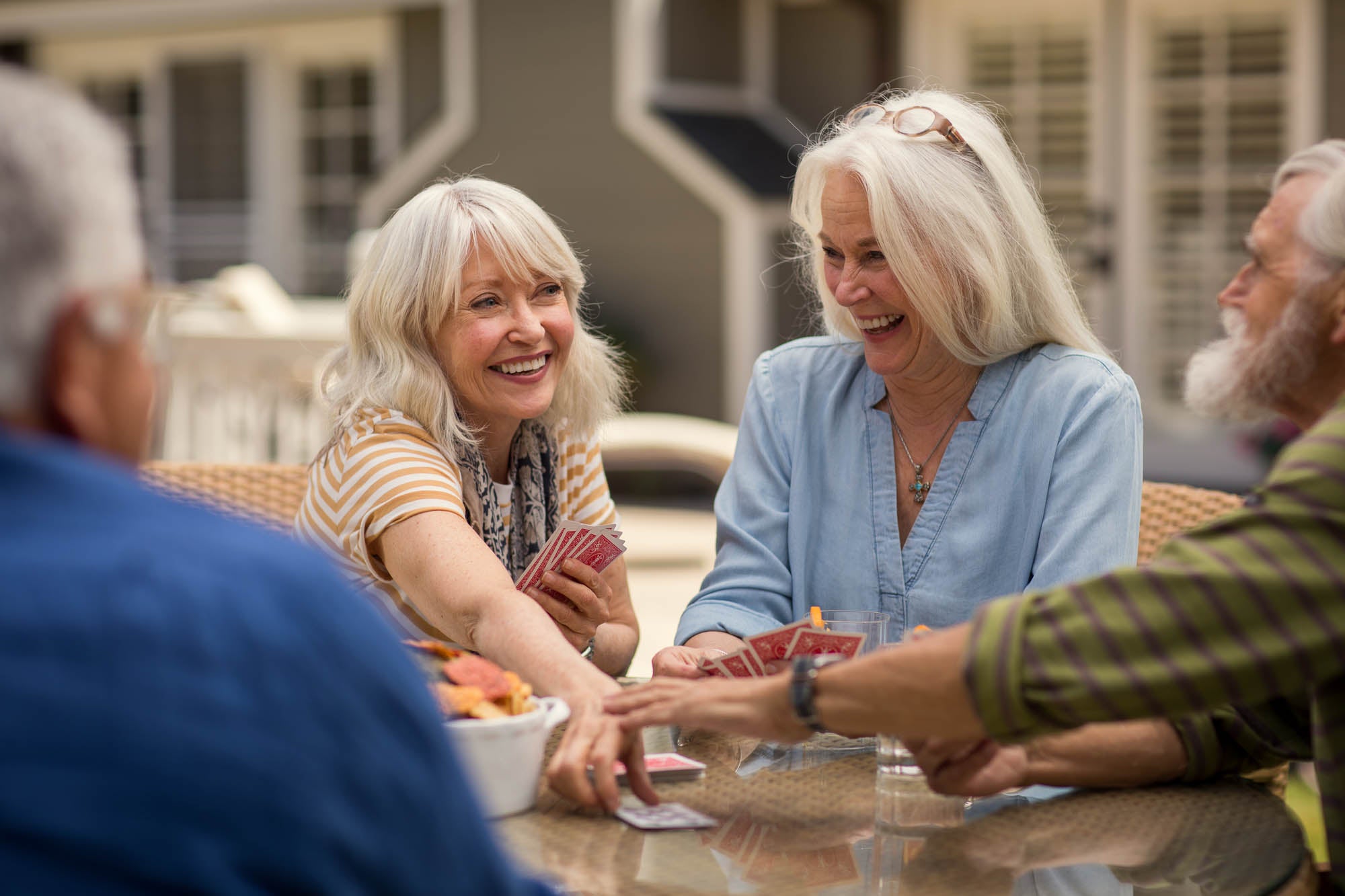 seniors playing cards with friends